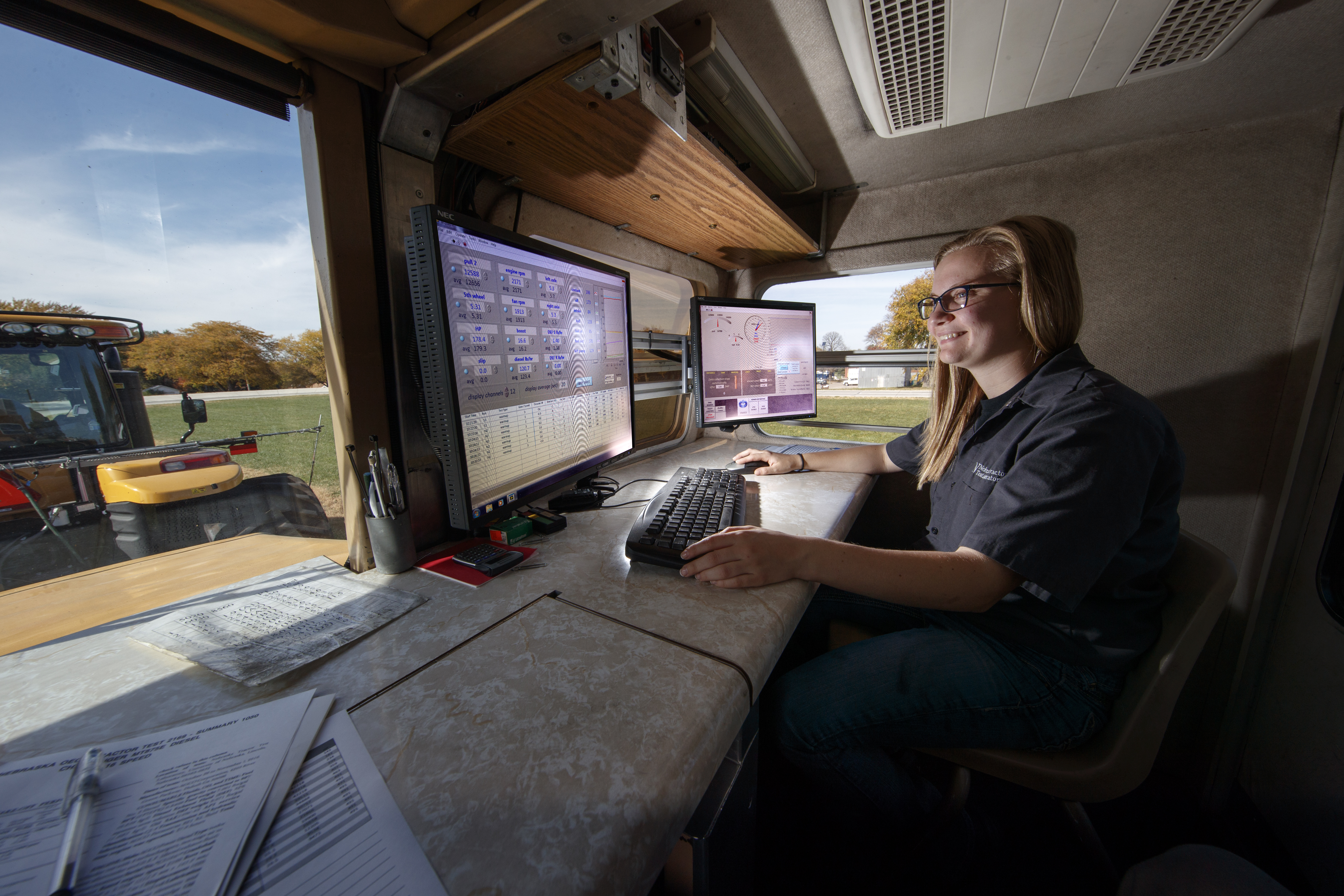 Jordan Bothern, a junior mechanized systems management major, monitors computer readouts in a test car being pulled at the Nebraska Tractor Test Laboratory.