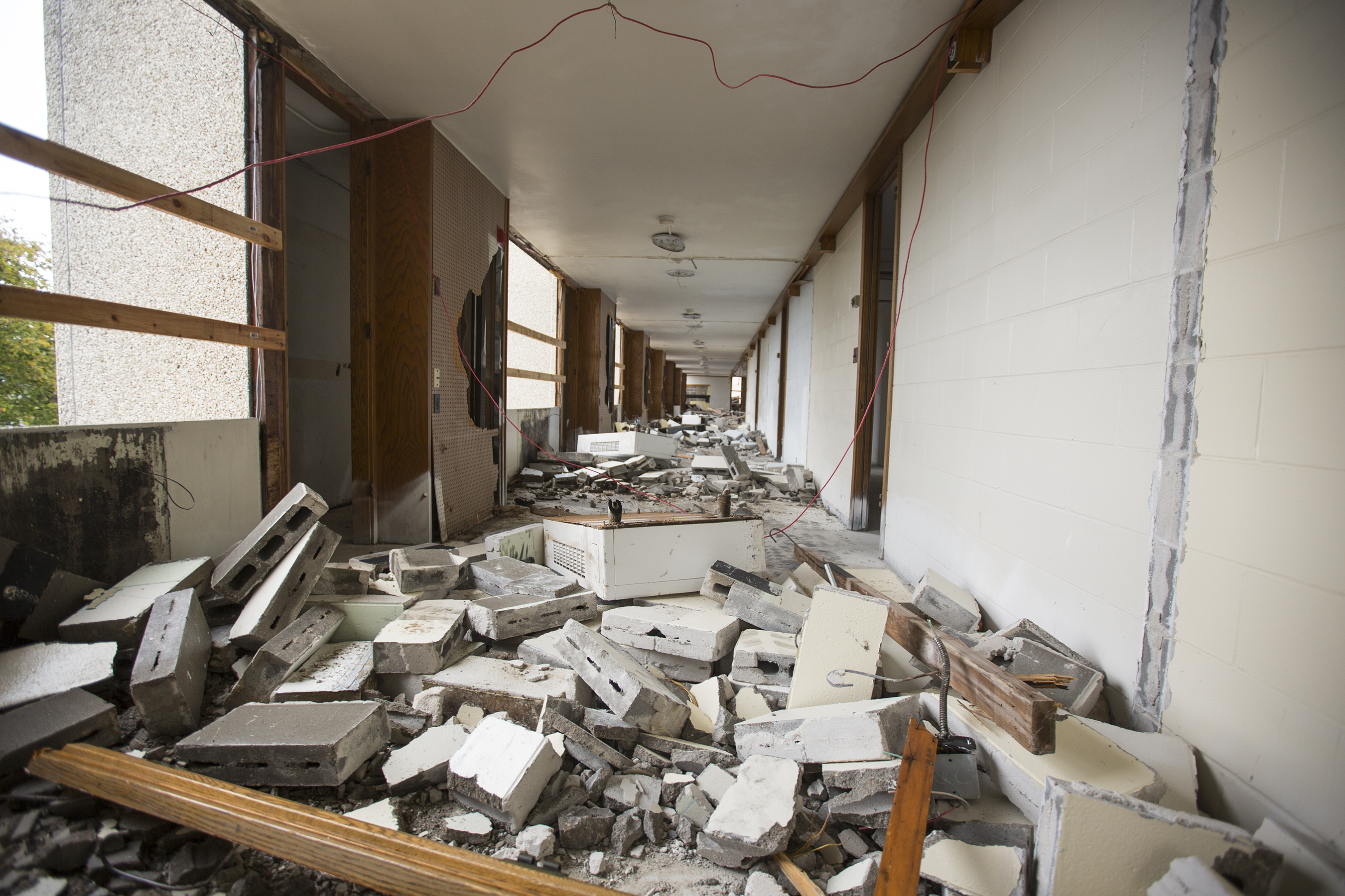 Walls between rooms on the fourth floor of Cather Hall have been turned to rubble as part of implosion prep.