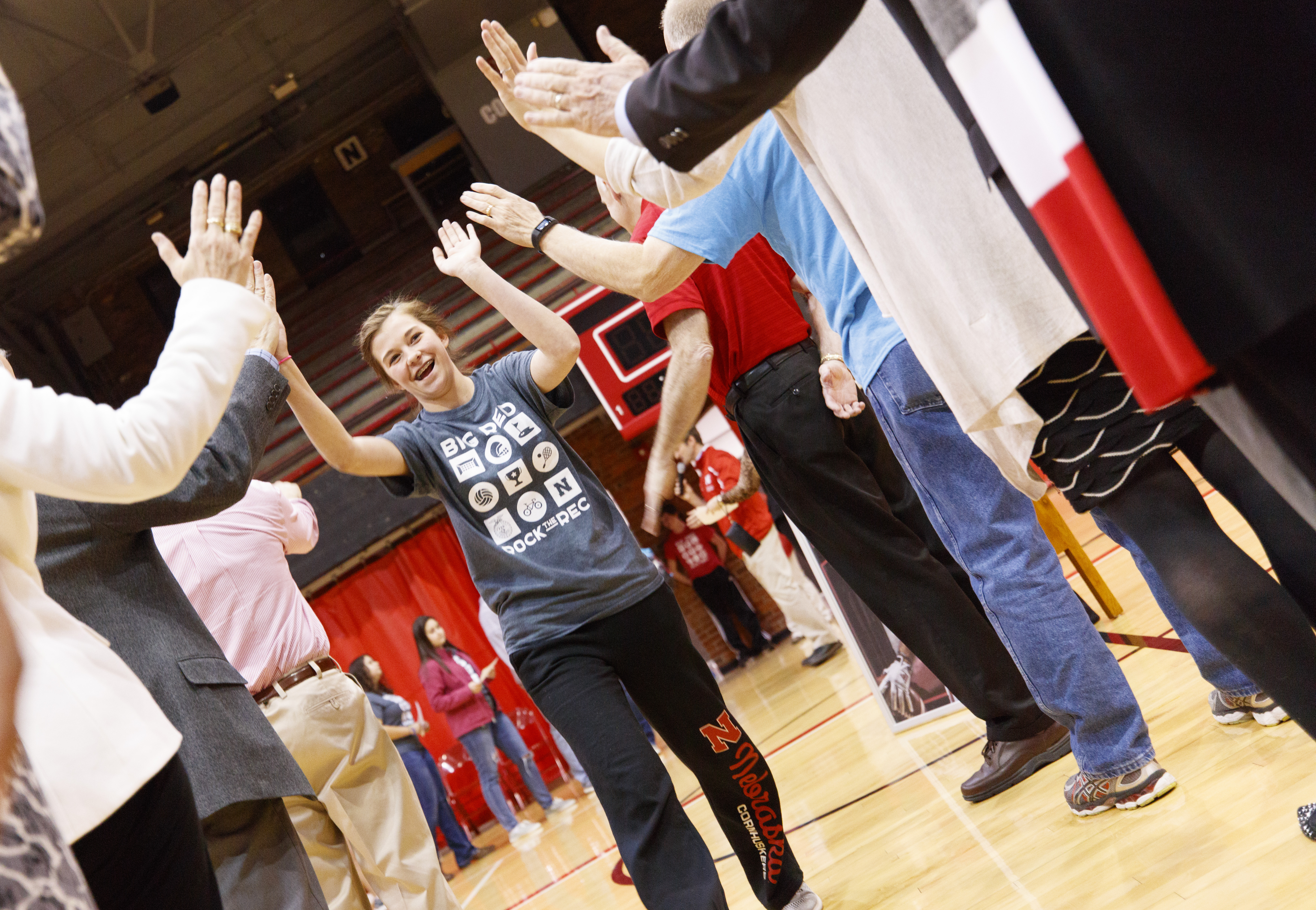 An FFA member and University of Nebraska-Lincoln commit receives high-fives during the signing ceremony April 6 at the Coliseum.