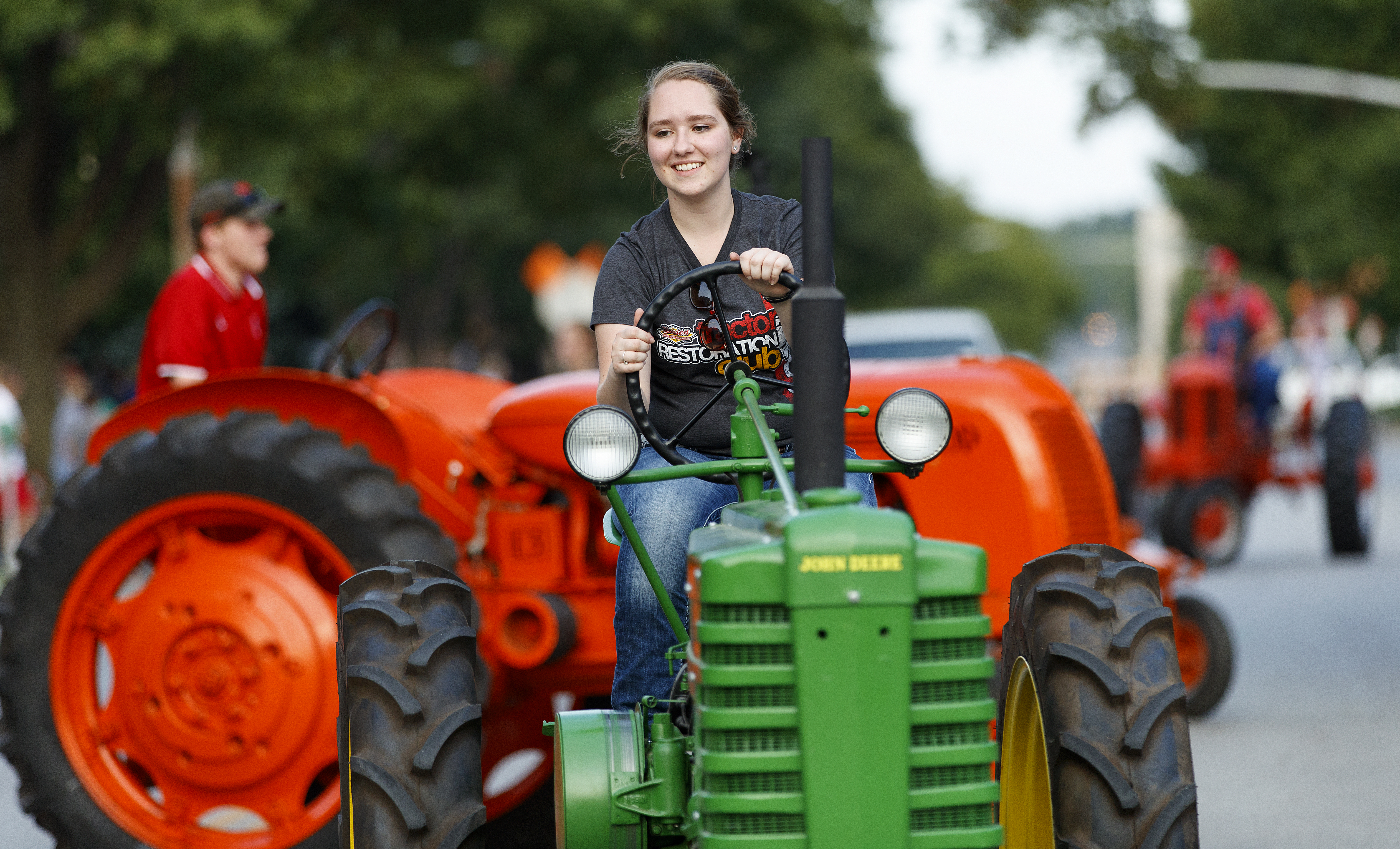 Members of the Tractor Restoration Club drive in Nebraska's 2017 homecoming parade on Sept. 22.