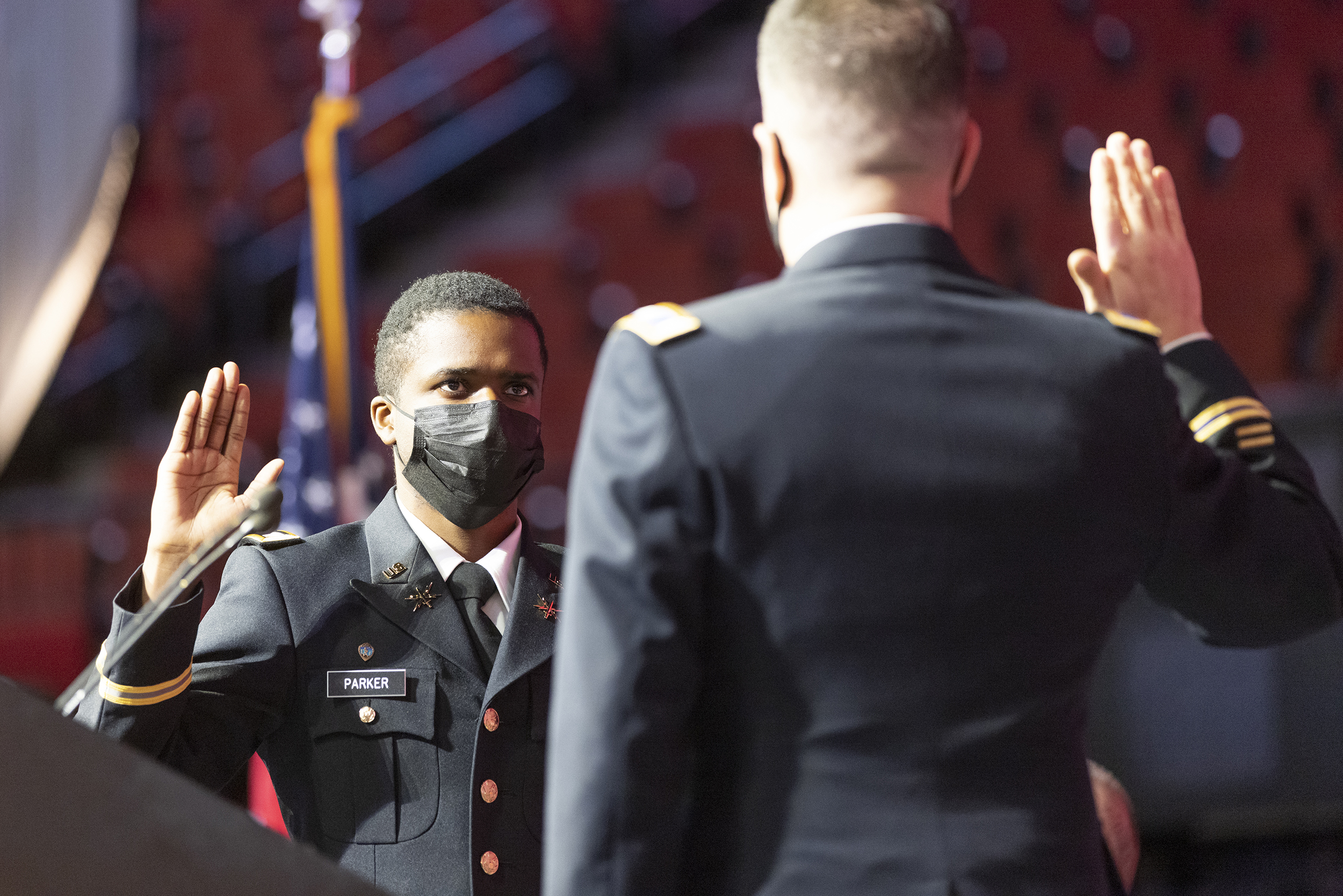 Hunter Parker takes the oath of office during the undergraduate commencement ceremony Dec. 18 at Pinnacle Bank Arena. Col. Thad Fineran, chief of staff of the Nebraska National Guard, administers the oath. Parker was commissioned a second lieutenant in the U. S. Army during a ceremony Dec. 17.