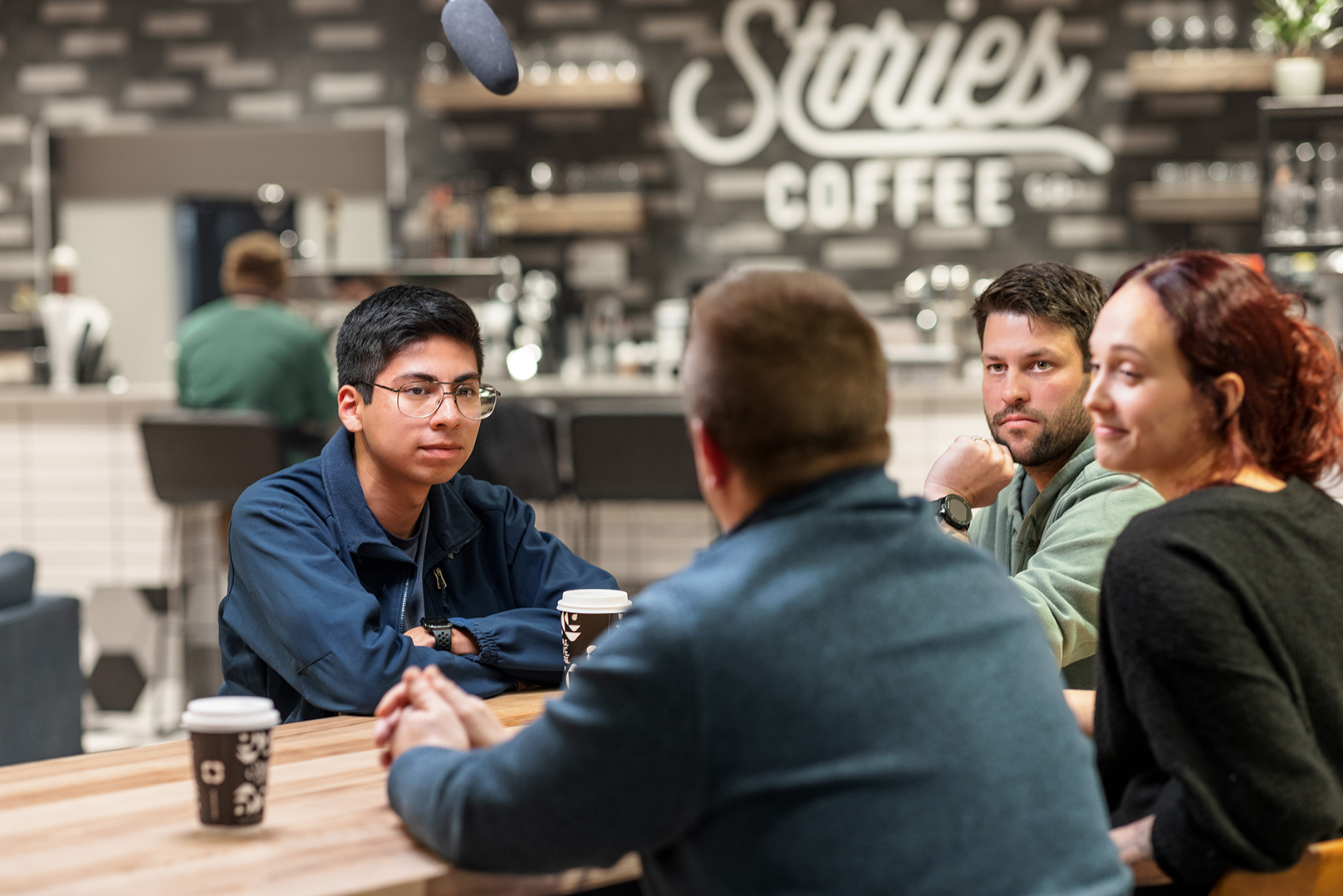 Carlos Ortega (left) and Julia Barrett (right) meet with Josh Monroe and Tom Whisinnand, teachers in the Omaha metro and co-hosts on the podcast "What the World Needs Now," to discuss what teaching looks like for them in Nebraska.