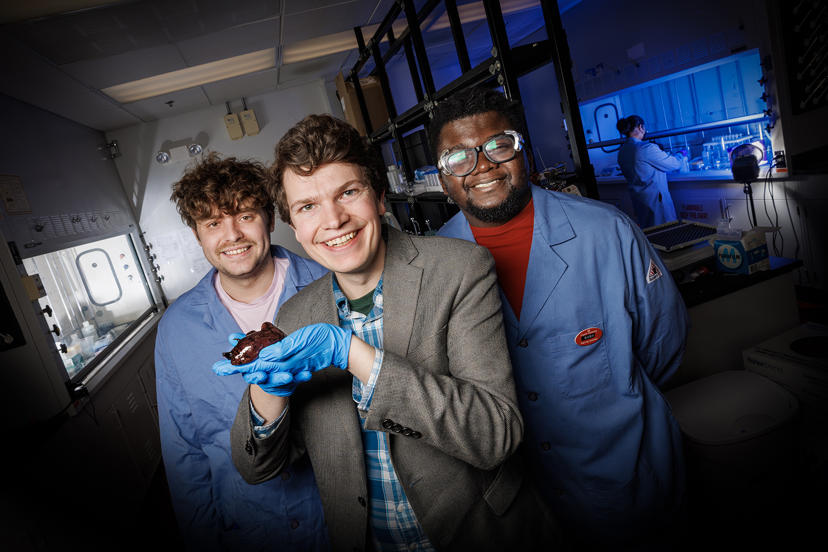 James Checco, Baba Yussif and Cole Blasing with a sea slug