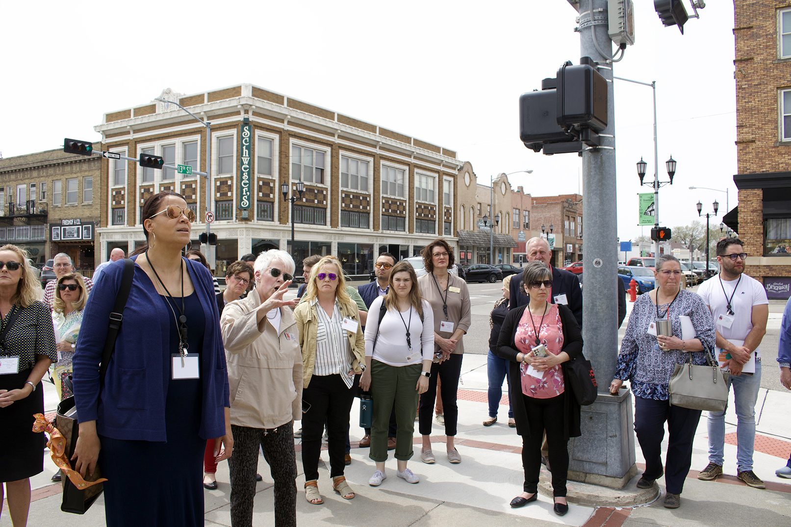 Rural Prosperity Nebraska’s Kim Wilson leads a walking tour of Columbus, highlighting the downtown economic area.