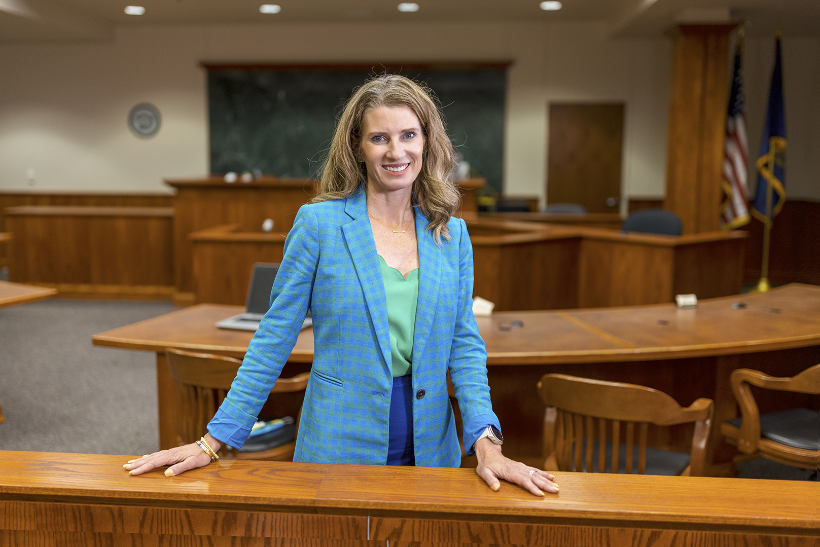 Professor Michelle Paxton stands in an empty courtroom.