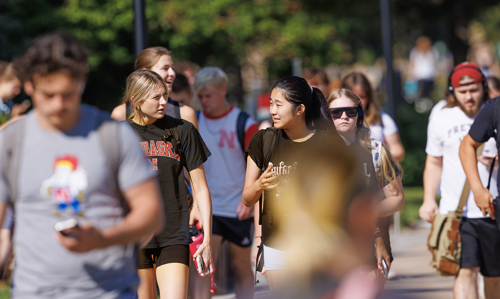 Brooklynn Hunke, a freshman from Gretna, Nebraska, talks with Misora Okuoka, a sophomore from Japan. The university’s latest annual census shows a 3.6% increase in first-time freshmen from Nebraska.