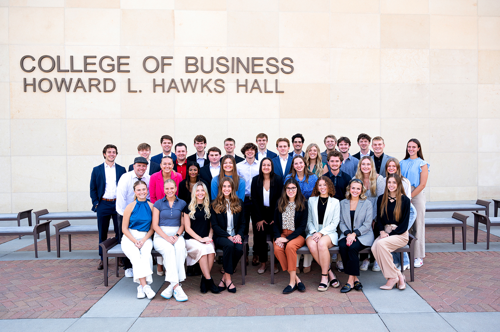 The 34 new Clifton Builders pose for a photo west of Howard L. Hawks Hall.