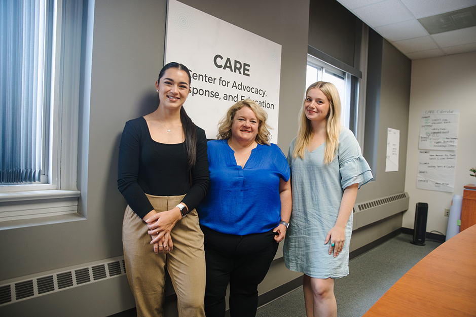 CARE staff Jenessa Jarvis, survivor support advocate, Melissa Wilkerson, director and survivor support advocate, and Abbey Ragain, prevention program coordinator in the CARE office in Pound Hall.