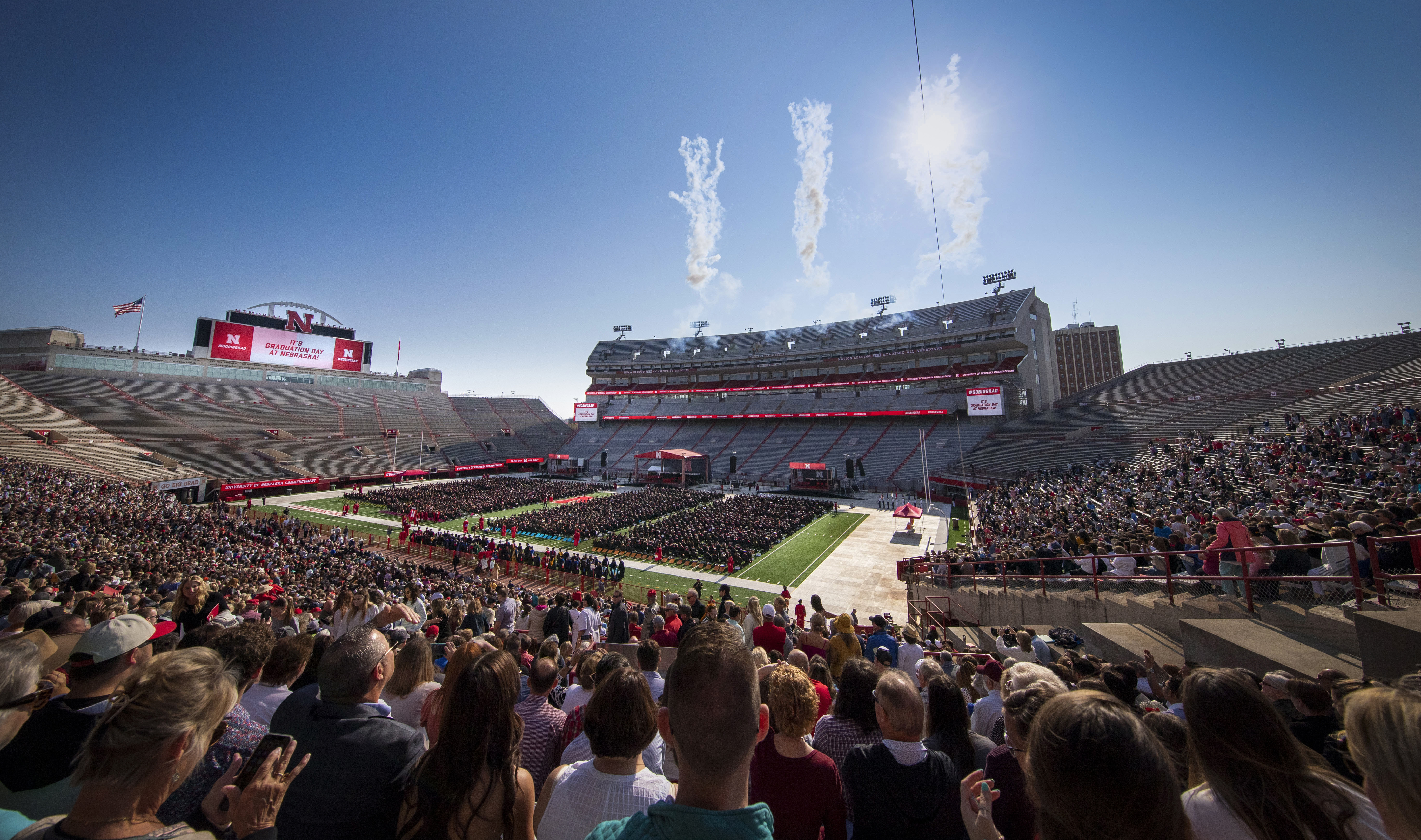 Fireworks explode over Memorial Stadium during commencement.