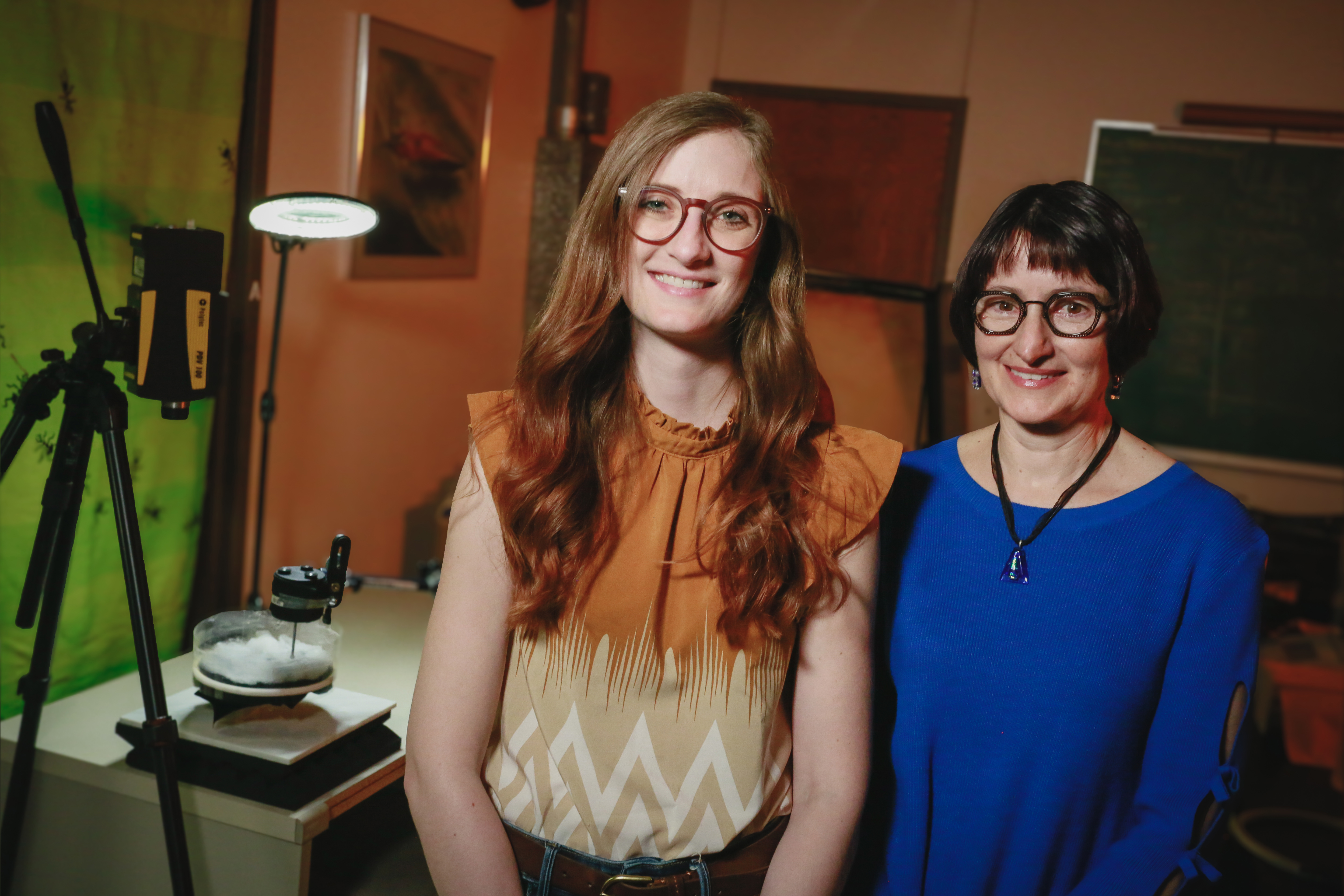 Brandi Pessman (left), postdoctoral research associate in the School of Biological Sciences, and Eileen Hebets, George Holmes Professor of biological sciences, pose next to imaging equipment.