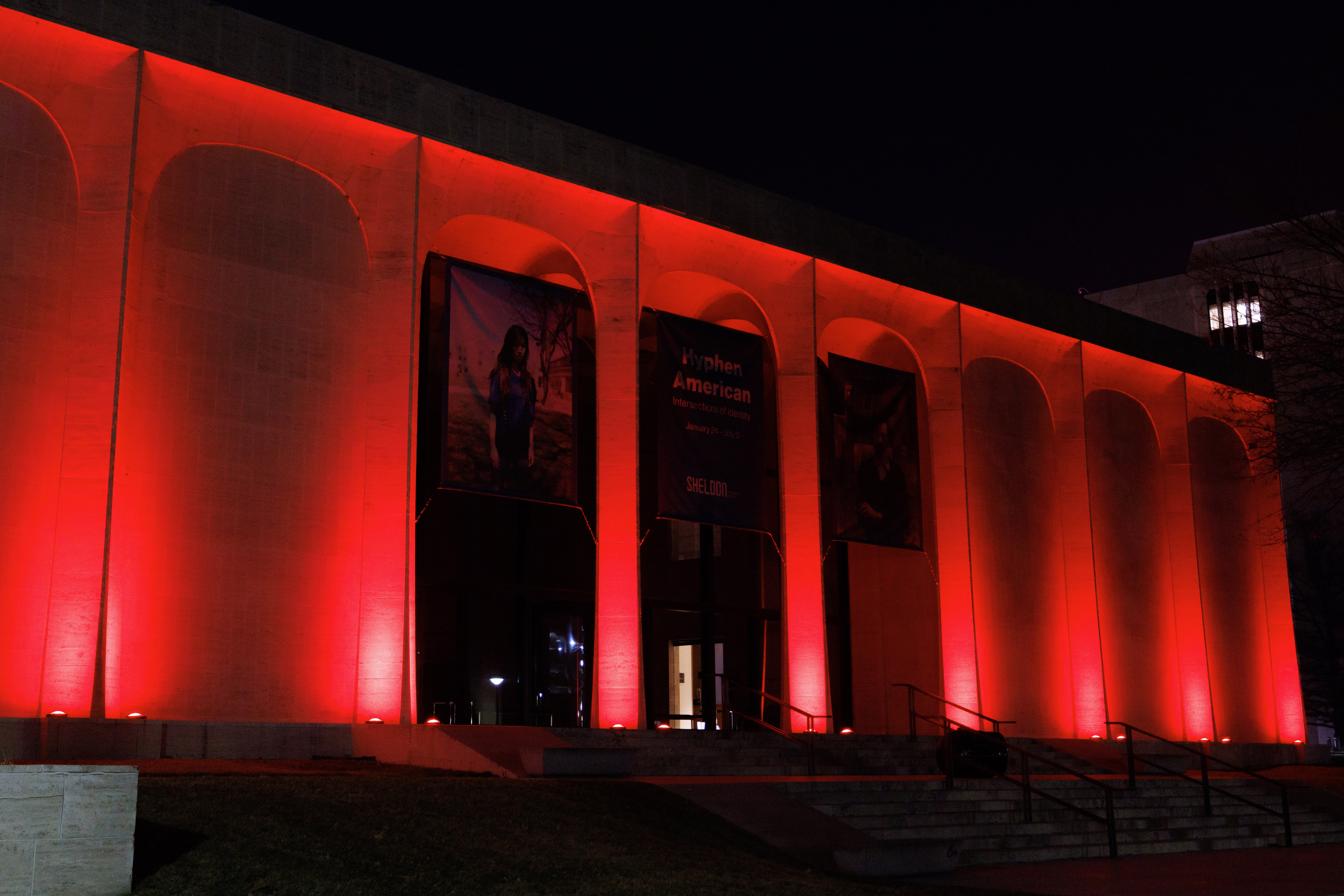 Sheldon Museum of Art is illuminated in red for Glow Big Red.