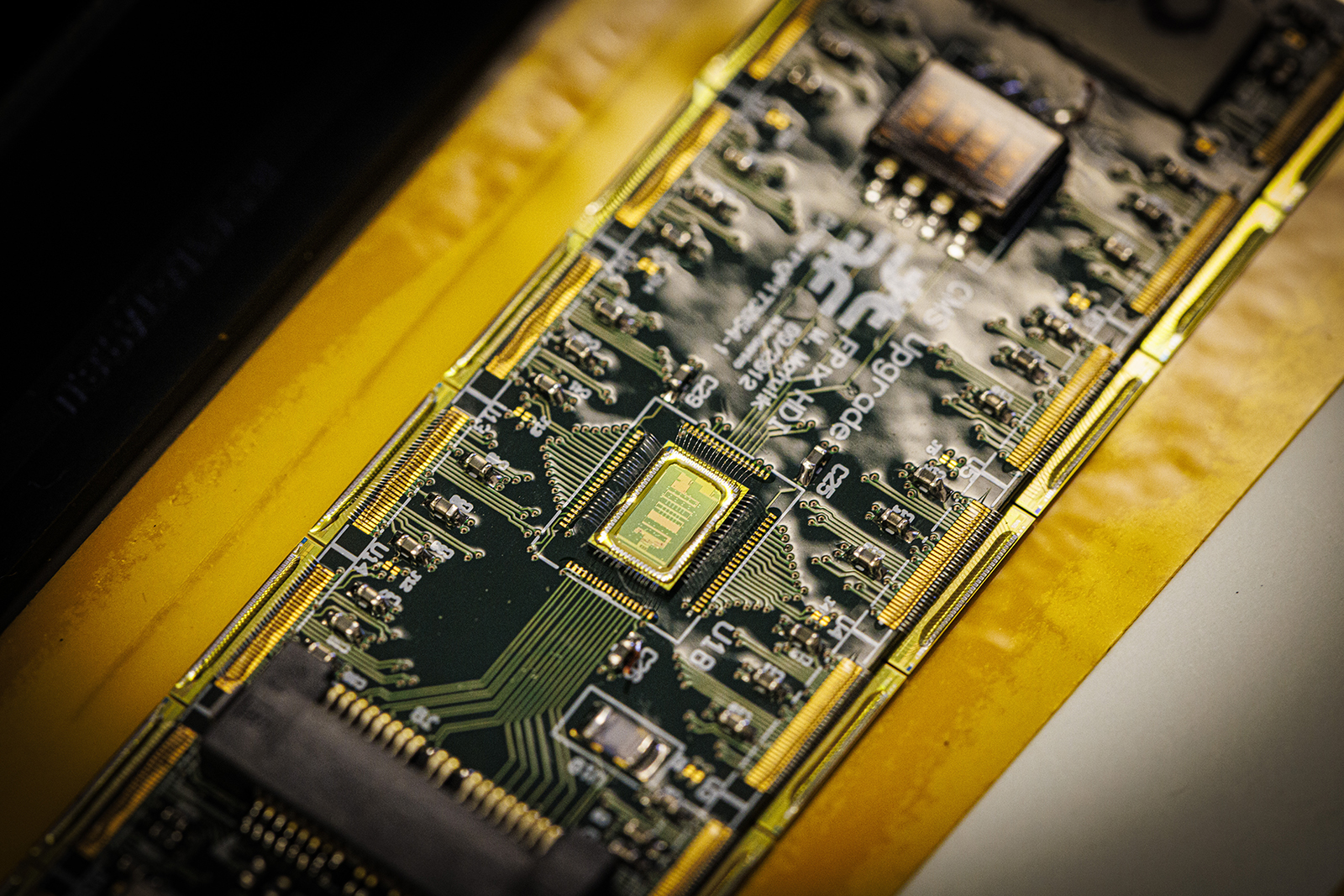 Close up of a circuit being assembled for the Large Hadron Collider in Jorgensen Hall.