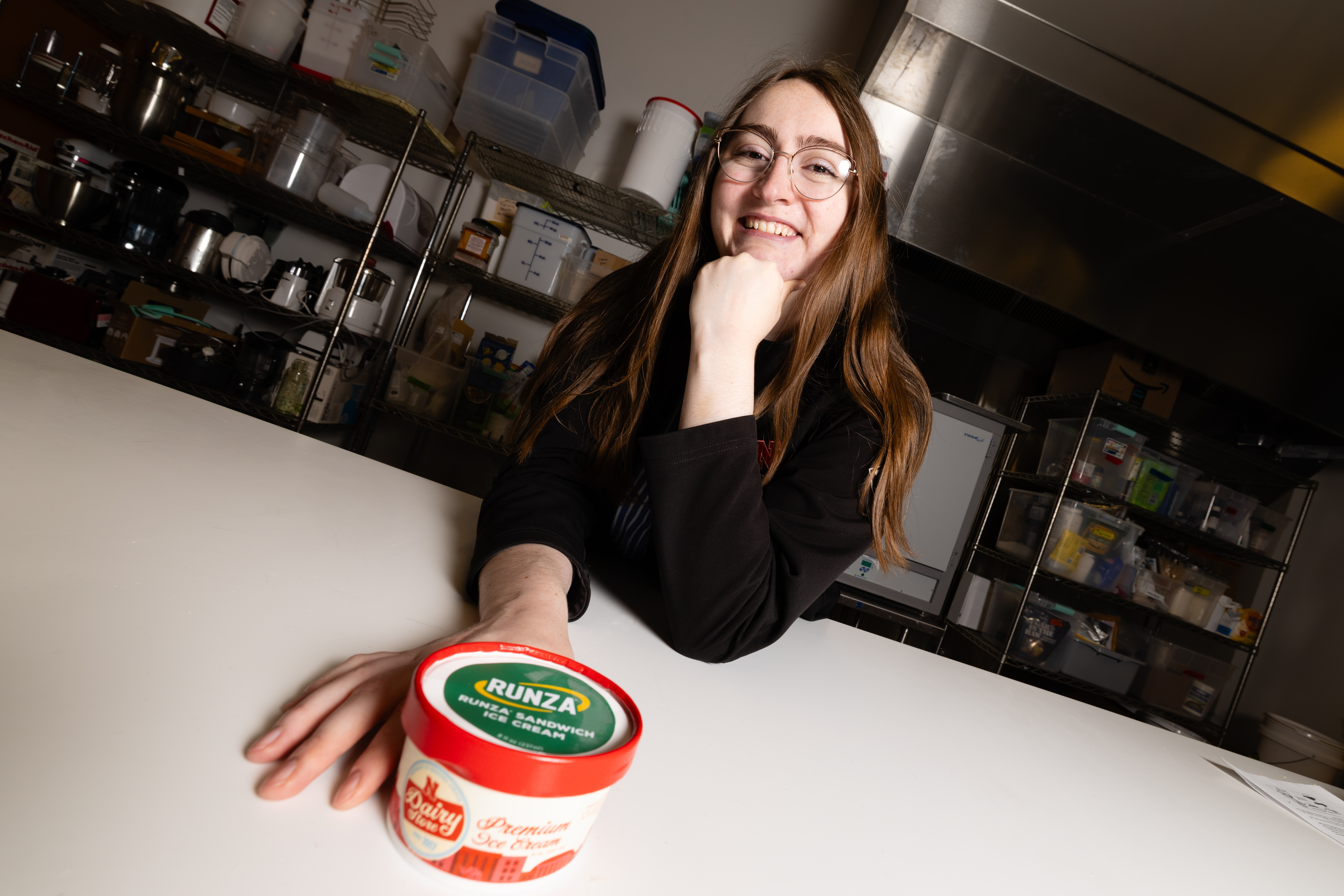 April Johnson, product development project manager in the Food Processing Center, poses with a container of Runza-flavored ice cream in the product development lab. Johnson led development of the limited-release frozen treat, which contains Runza's unique spice blend, cabbage flavor and pie dough in place of bread.