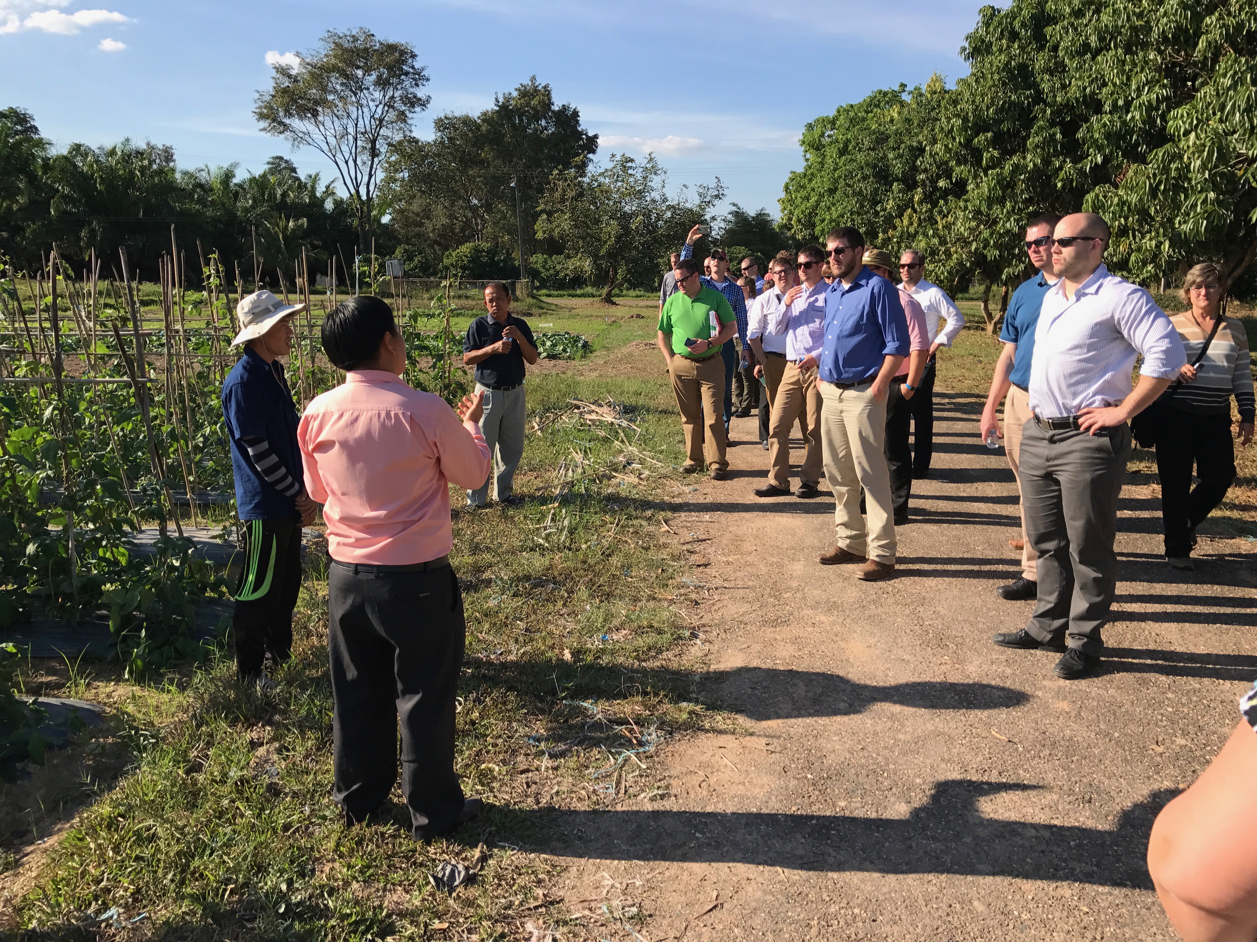 LEAD 35 fellows listen to researchers discuss vegetable cropping systems at the Development and Agricultural Services Center located outside of Vientiane, Laos. 