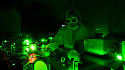 A technician adjusts the Diocles Laser in UNL's Extreme Light Laboratory. The lab is led by Donald Umstadter, one of four UNL researchers featured in the first report from the University of Nebraska's National Strategic Research Institute.