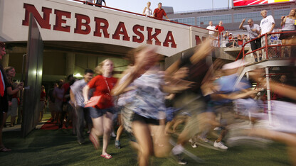 Students flood into Memorial Stadium during a UNL's annual Big Red Welcome event. This year, UNL will launch the First Husker program to offer support to first-generation college students.