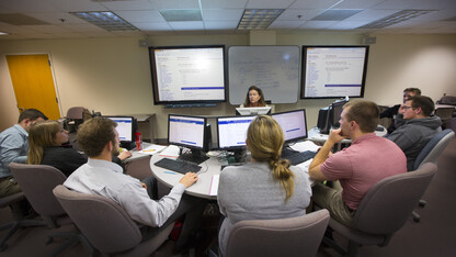 Donna Dudney, associate professor of finance in the College of Business, leads a finance course. The Board of Regents approved a name change for the college, dropping the name administration, on March 31.