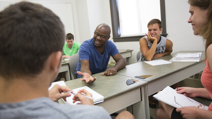 Deadric Williams (second from left), a post-doctoral research associate, leads a discussion with students in his sociology class. A recent poll of rural Nebraskans showed that 65 percent of respondents said a college degree is necessary to get ahead in life.