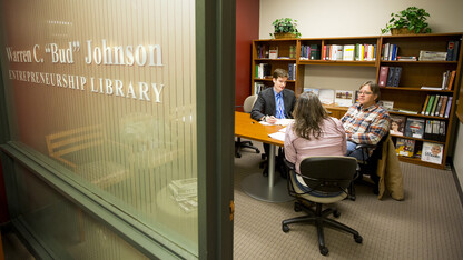 Nebraska law student Daniel Sweeney (left) meets with Lisa and Cameron Lauver of Pierce as part of the College of Law’s Entrepreneurship Legal Clinic.