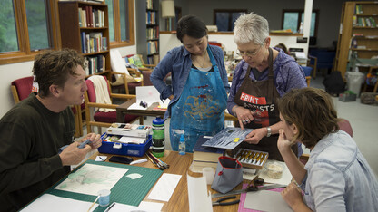 Karen Kunc, professor of art, discusses a printmaking techique with students enrolled in the Art at Cedar Point course. The new summer course is held at the UNL's Cedar Point Biological Station and allows students to focus solely on creating art for two weeks.