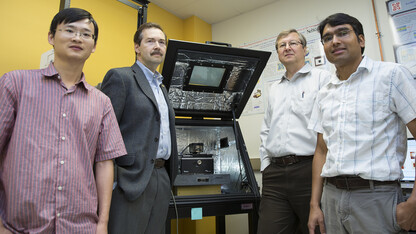 (From left) Haidong Lu, postdoctoral researcher; Alexei Gruverman, professor of physics and astronomy; Evgeny Tsymbal, professor of physics and astronomy; and Tula R. Paudel, research assistant professor. The scientists are affiliated with the Nebraska Center for Materials and Nanoscience. Tsymbal is director of the NSF-supported Materials Research Science and Engineering Center at UNL.  