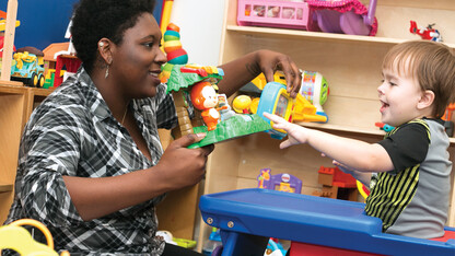 Micheale Marcus works with a child as part of the university's early childhood autism spectrum disorder training program.