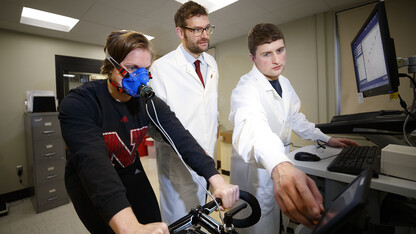 Karsten Koehler (center) works with students in his exercise science lab in Nebraska's Department of Nutrition and Health Sciences.