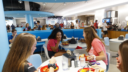Huskers share a laugh as they eat in Nebraska's new Willa Cather Dining Complex. The dining center opened in summer 2017.