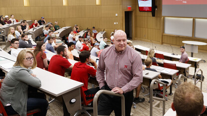 Business professor Kevin Wesley listens as students talk about their experience with managers during the first hour of Management 300 in the College of Business' new Howard L. Hawks Hall on Aug. 21. 