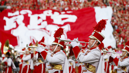 The Cornhusker Marching Band performs at the start of the Sept. 2 game with Arkansas State University. More than 30 members of the band are participating in the 22 in 22 Challenge, which is designed to raise awareness about veteran suicides and raise funds for veteran support services.