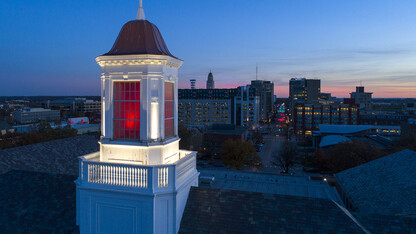 Love Library cupola glows red over downtown Lincoln as the sun sets to the west on Nov. 15.