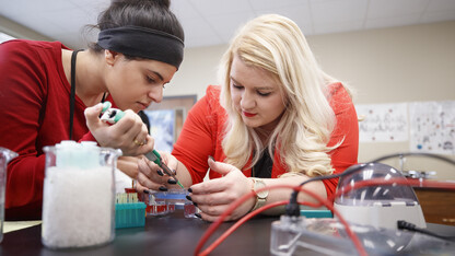 College of Education and Human Sciences student Cassidy Daly gives a DNA demonstration as during a student teaching experience at Northeast High School in Lincoln. Graduate programs within the college were recently ranked amongst the top 40 in the nation.