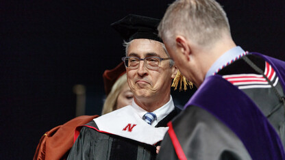 Film director Alexander Payne reacts while he was hooded when receiving an honorary doctorate degree during University of Nebraska–Lincoln commencement exercises on May 5.