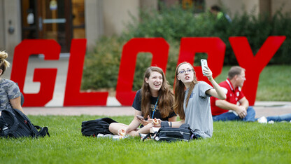 Huskers (from left) Miranda Mueller and Miranda Hornung take a selfie while enjoying their lunches during the Aug. 31 “In Our Grit, Our Glory” celebration on East Campus.