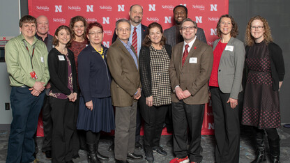A group of Nebraska faculty and staff pose for a photo during the Parents' Association awards.