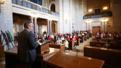 Chancellor Ronnie Green talks to NU supporters at the start of the advocacy day event. More than 100 students, supporters and alumni attended the event.