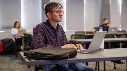Chad Brassil, associate professor of biological sciences, listens as instructional designers from the Center for Transformative Teaching present ideas for a smooth transition to remote learning during a March 17 session. The center is offering a one-week, spring break course to help instructors overcome remote teaching challenges. Learn more at https://go.unl.edu/rm4z.