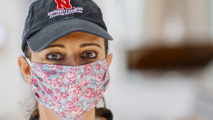 Simone Bilha, a dining service team leader in the Willa Cather Dining Center, wears a homemade cloth mask as she works on April 7. The university is seeking the donation of more than 1,000 homemade masks for essential employees. The masks will help increase safety for workers who continue to serve the campus community.