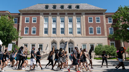Protestors walk past the south entrance of the Nebraska Union during a march to the Nebraska State Capitol on June 13, 2020. A new course offered in the College of Journalism and Mass Communications is exploring what it's like being Black and living in Lincoln.