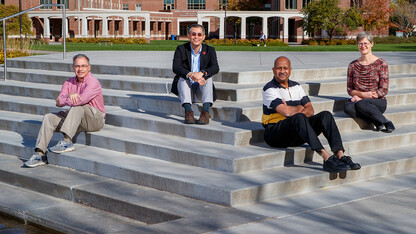Mike Hayes, Leen-Kiat Soh, Ashok Samal and Regina Werum are members of a multidisciplinary research team that integrates computer science and the social sciences to develop a model that anticipates social unrest events. The photo is a composite of four individual photos, allowing the researchers to appear without their masks.