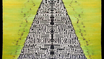 "Mountain for Buddha — Envy," a weft-faced ikat tapestry (wrapped, dyed and woven wool on linen warp) made by Mary Zicafoose.