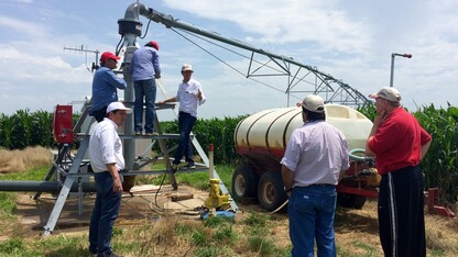 Argentine delegates discuss center pivot technology with Andy Suyker, associate professor in UNL's School of Natural Resources, during a visit to the Agricultural Research and Development Center near Mead on July 11.