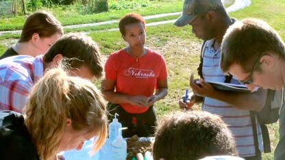 Martha Mamo, Weaver Professor of Agronomy and Horticulture, works with Nebraska students.