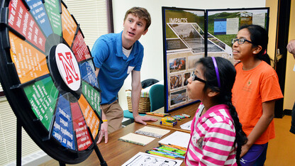 Claudia Carrillo (center) and Paula Carrillo (right) learn about drought from Jake Petr, a meteorology student in the School of Natural Resources, during the 16th annual Weatherfest in April 2016 at Hardin Hall. The 2017 event is April 1 at the Nebraska Innovation Campus Conference Center.