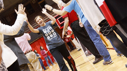 Katelyn Bendorf, an FFA member and University of Nebraska-Lincoln commit, receives high-fives during the signing ceremony April 6 at the Coliseum.