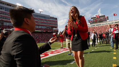 Homecoming king Shayne Arriola proposes to his girlfriend, homecoming queen Laura Springer, during halftime of the Nebraska-Rutgers football game on Sept. 23.