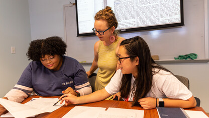 Katrina Jagodinsky, associate professor of history, advises two undergraduate researchers on a research project in the Center for Digital Research in the Humanities.