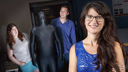 Maital Neta (front) was recently awarded a Faculty Early Career Development Program award from the National Science Foundation to study how humans respond differently to uncertainty. In this photo illustration, graduate students Catie Brown and Nick Harp react to a man dressed in a bodysuit to represent ambiguity.