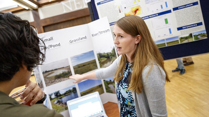 Cutline 1: Lauren Uhlig, a senior environmental studies and fisheries and wildlife major, presents findings from her summer UCARE project during a poster session Aug. 7 at the Nebraska Union. Uhlig worked closely with Deborah Bathke, a climate scientist at the National Drought Mitigation Center; and Theresa Jedd, an environmental policy specialist at the drought center; on the project.