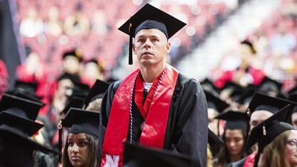 Eric Alan Bohnenkamp stands to be recognized during the summer commencement ceremony Aug. 17 at Pinnacle Bank Arena. He was commissioned a second lieutenant in the U.S. Marine Corps on Aug. 17.